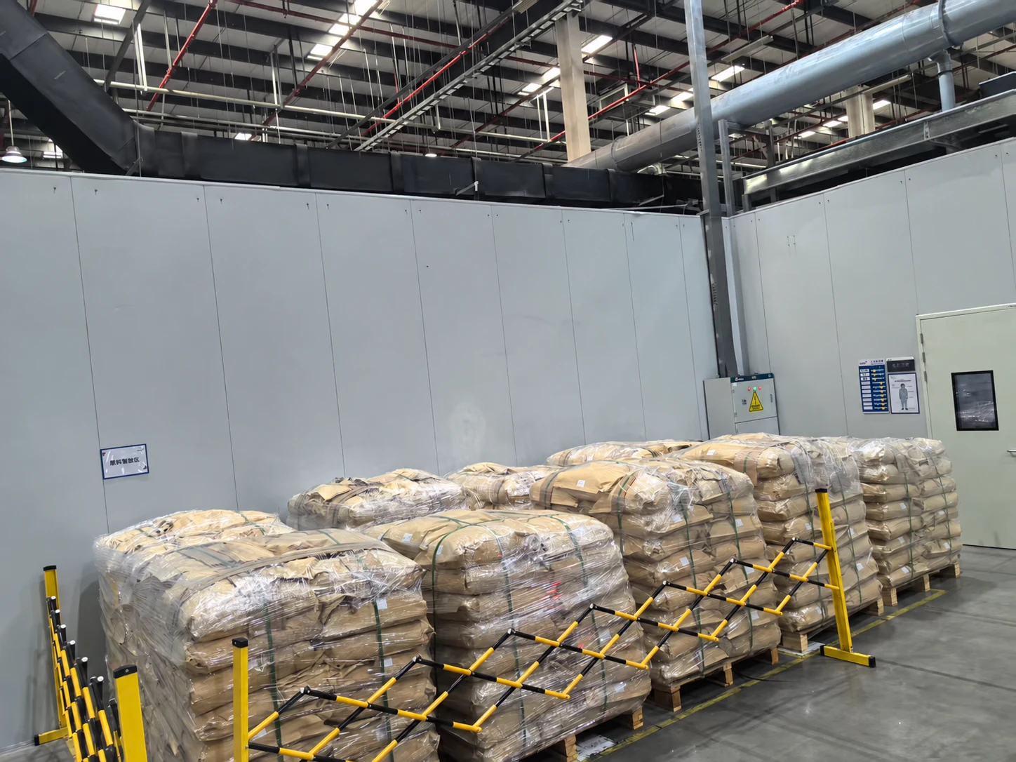 Warehouse reference photo showing palletized material bags